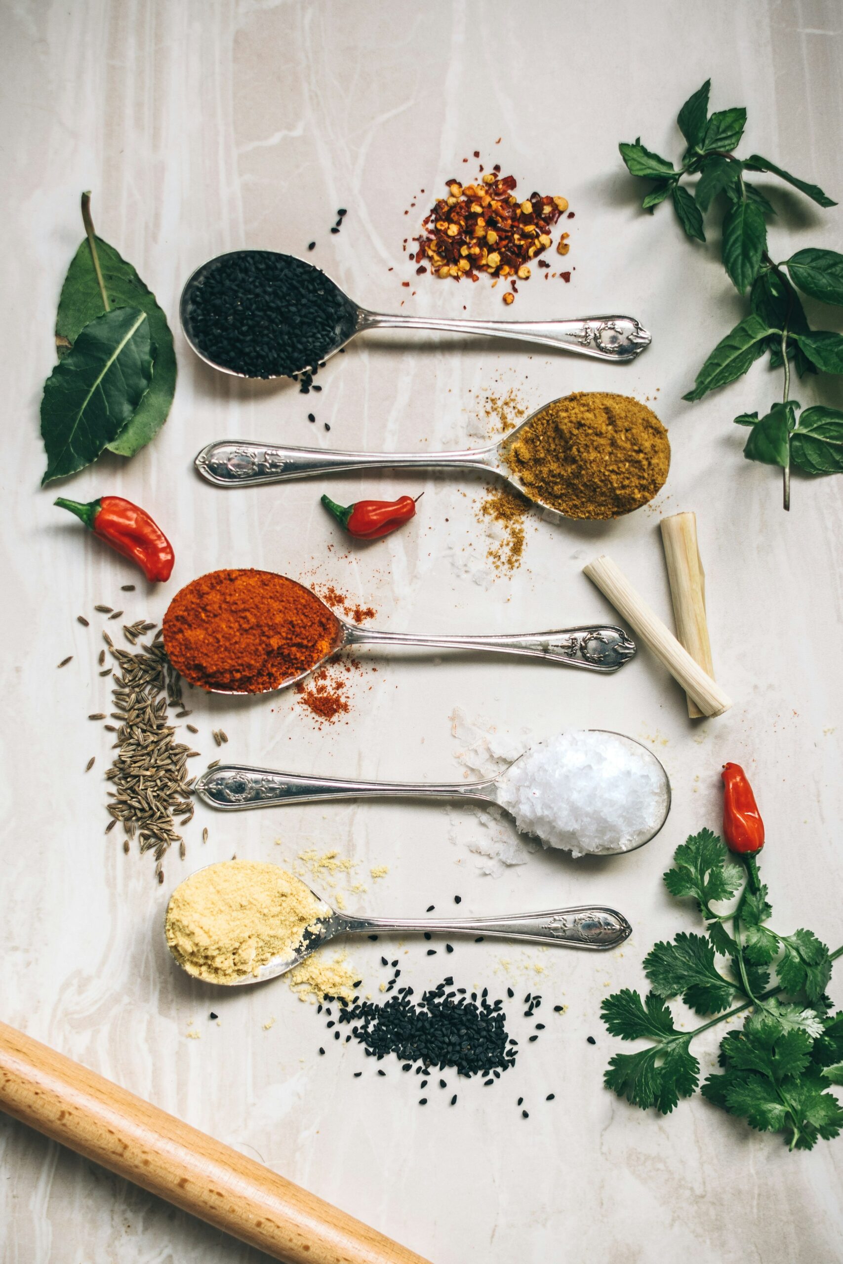 Sri Lankan spices and dried herbs arranged in small bowls