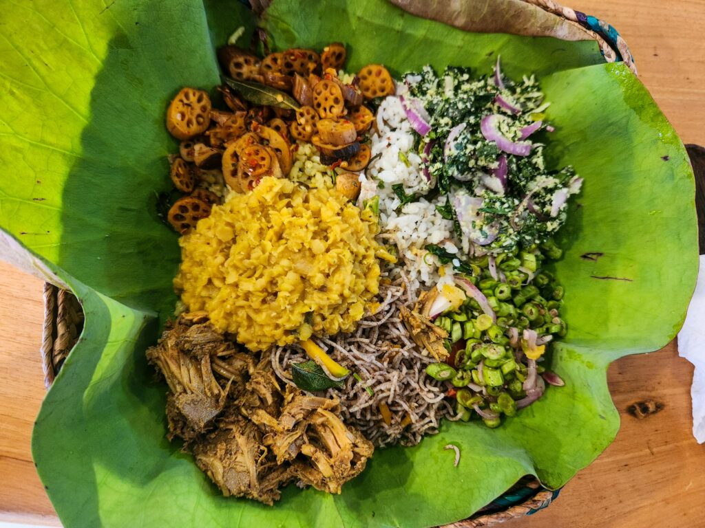 Sri Lankan rice and curry served on a banana leaf with vegetable sambols
